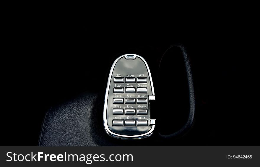 A number pad for telephone on dark background. A number pad for telephone on dark background.
