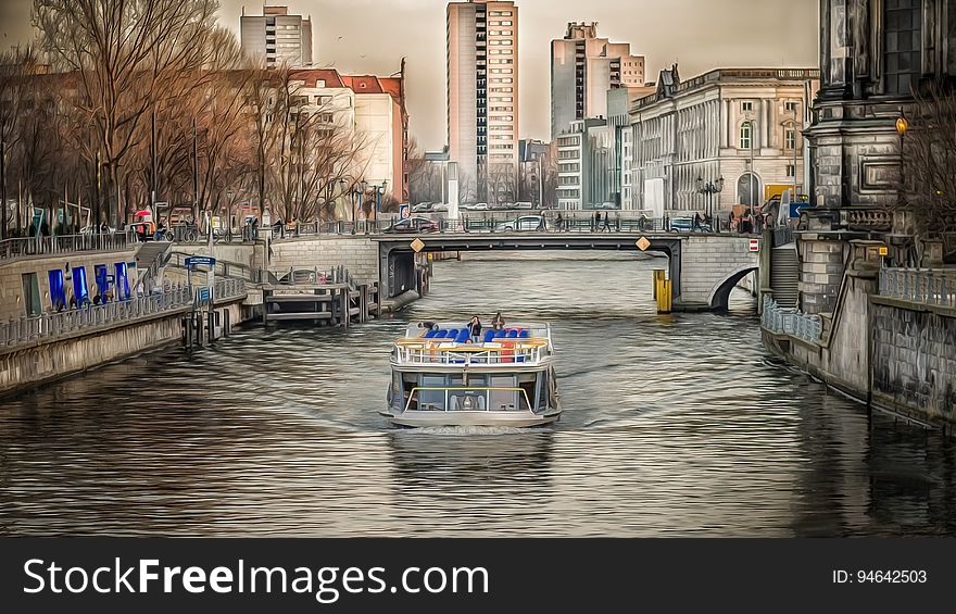 A boat cruising on the river Spree near Schlossplatz in Berlin. A boat cruising on the river Spree near Schlossplatz in Berlin.