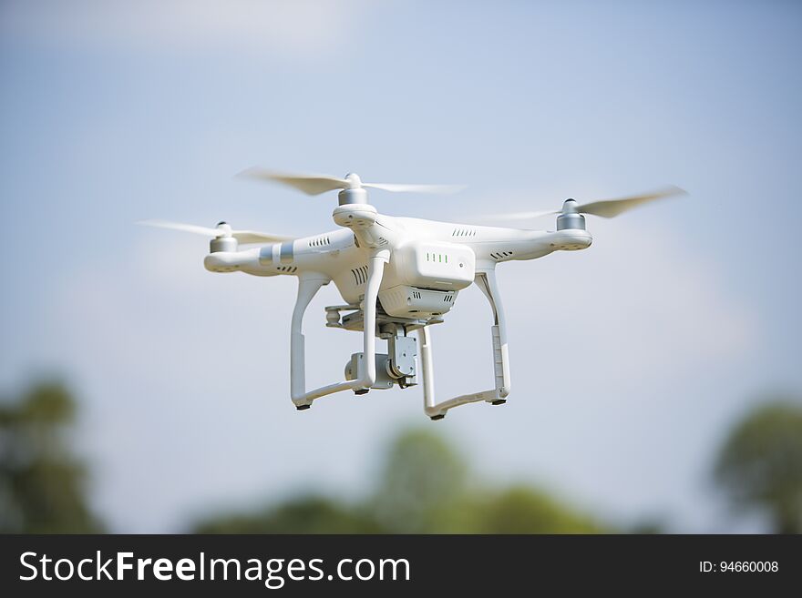 Drone quad copter with high resolution digital camera flying hov