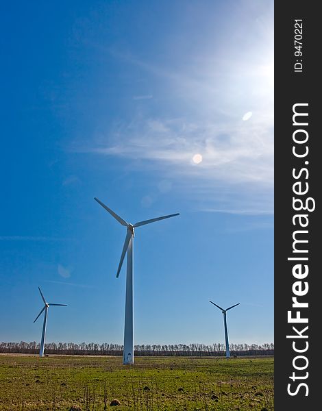 Wind power station against the sky and clouds