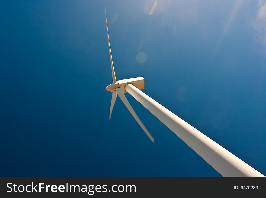 Wind power station against the sky and clouds