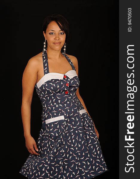 A closeup portrait of a pretty African American teenage woman.  Black background. A closeup portrait of a pretty African American teenage woman.  Black background