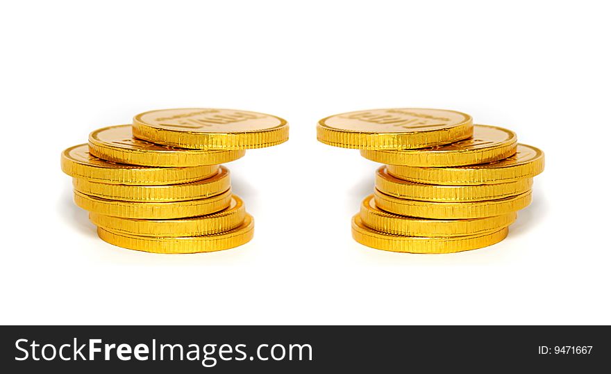 An image of golden coins tower over white background. An image of golden coins tower over white background