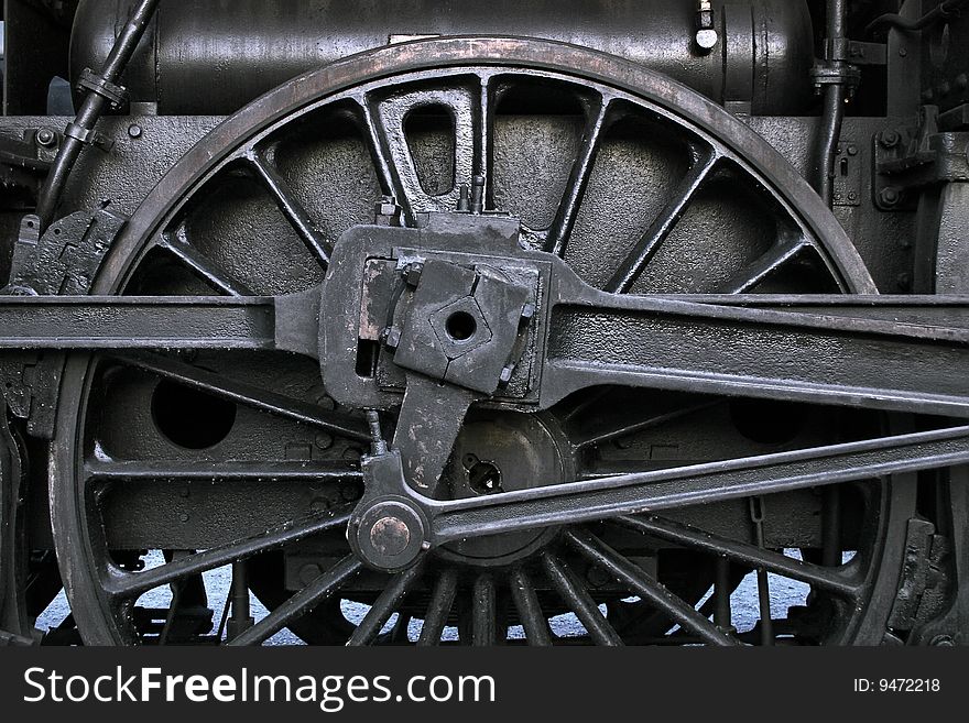 The old iron railway locomotive wheels.