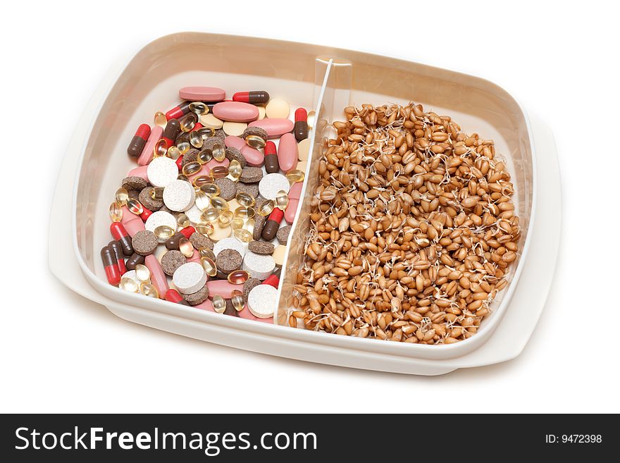 Container with pill, tablet and wheat on white background. Container with pill, tablet and wheat on white background