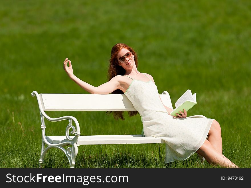 Woman relax in meadow in summer sun