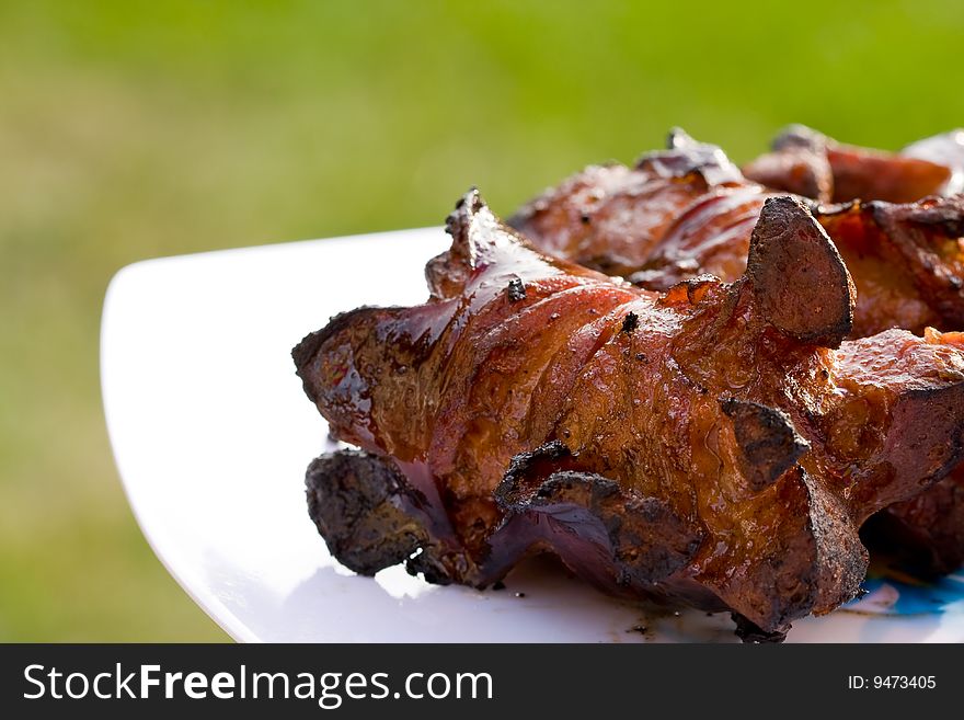 Sausages and chicken kebabs on a barbecue. Sausages and chicken kebabs on a barbecue