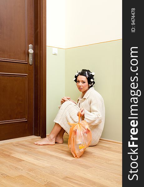 Woman sitting and waiting for new apartment. Woman sitting and waiting for new apartment
