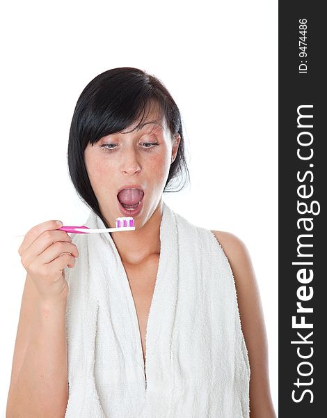 Woman cleaning tooth wearing towel. Woman cleaning tooth wearing towel