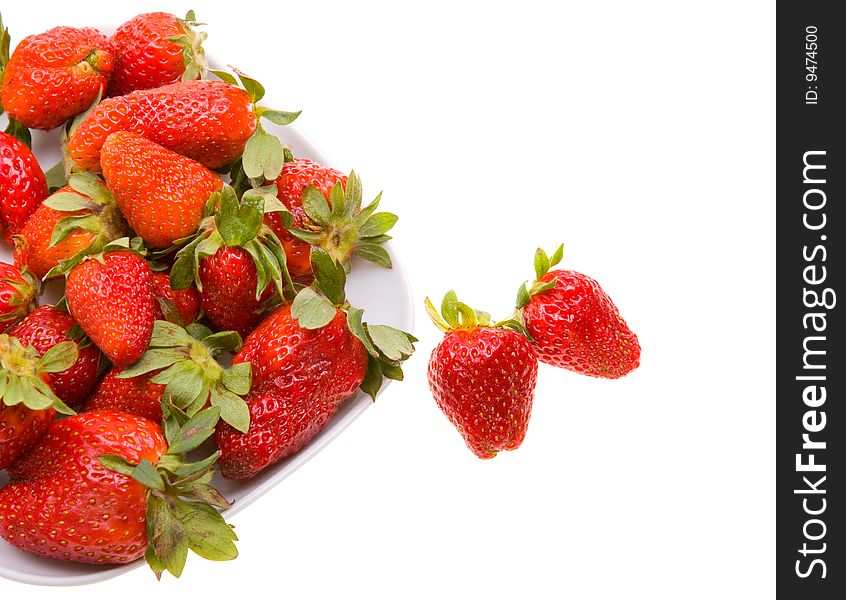 Fresh strawberries on a platter isolated on white background