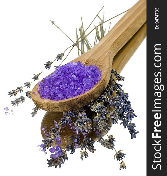 Bath salt in a wooden spoon with lavender