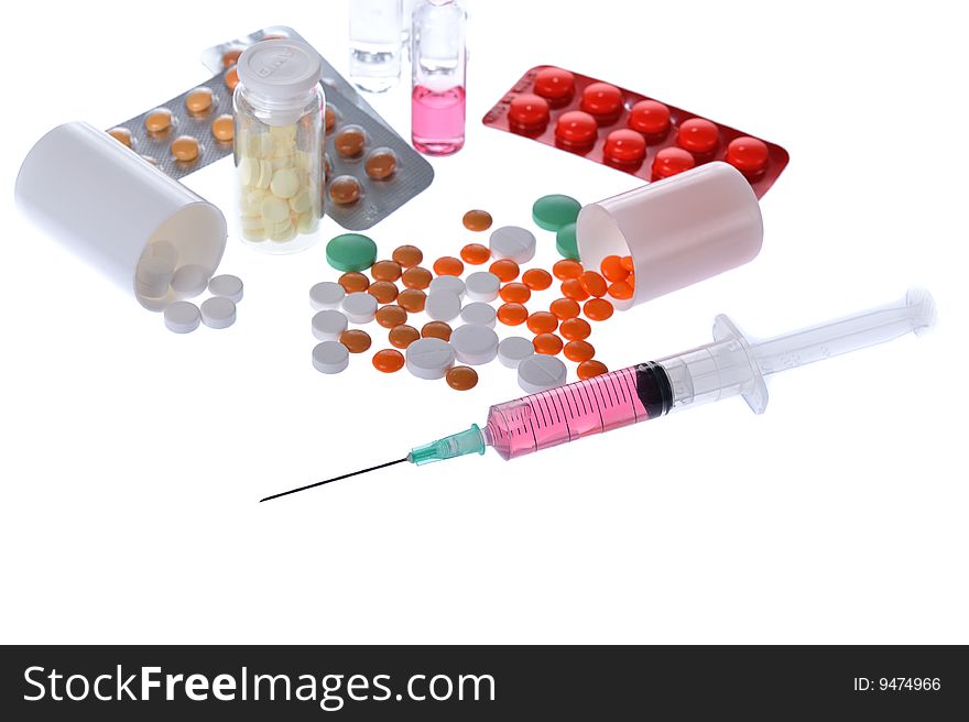 Colorful pills, ampules, syringle on white background. Colorful pills, ampules, syringle on white background