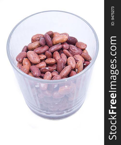 Kidney beans in the glass isolated on white