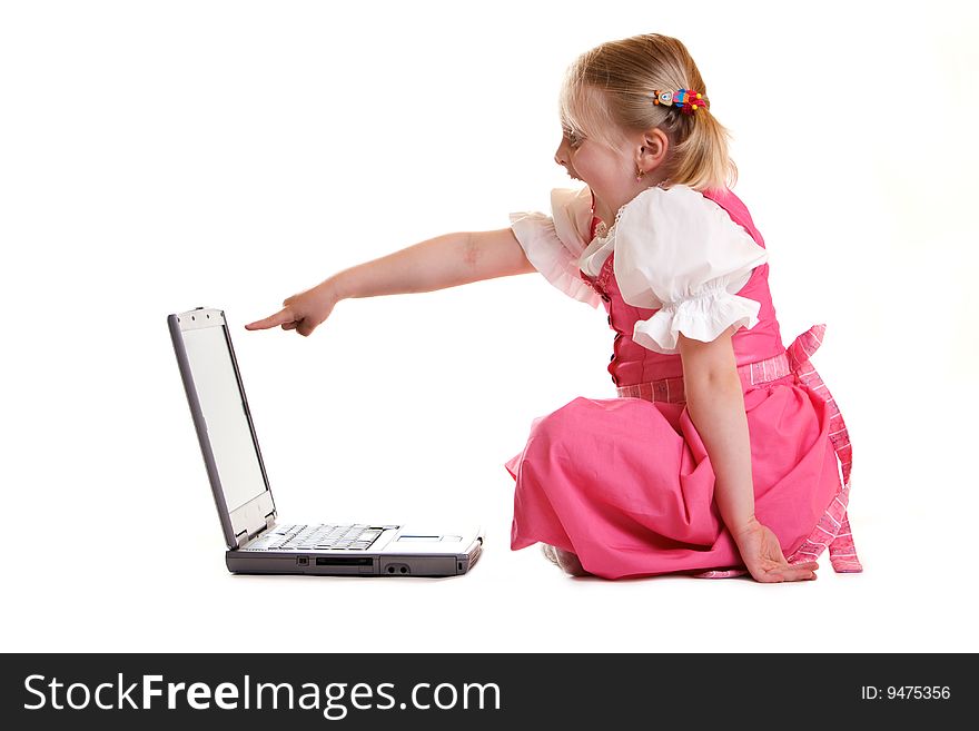 Young child sitting on computer found someting funny. Young child sitting on computer found someting funny