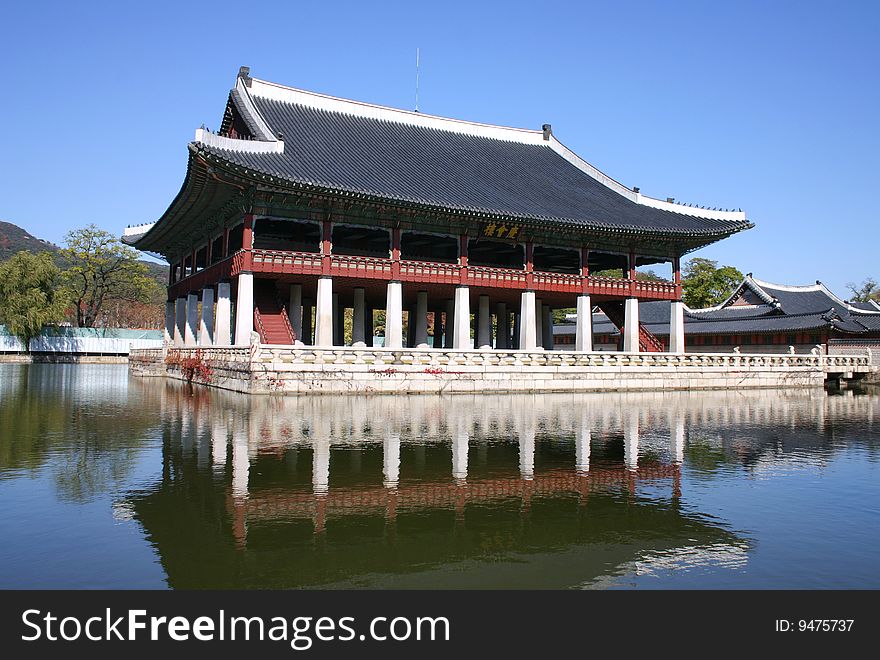 Ancient korean temple built on a pond.