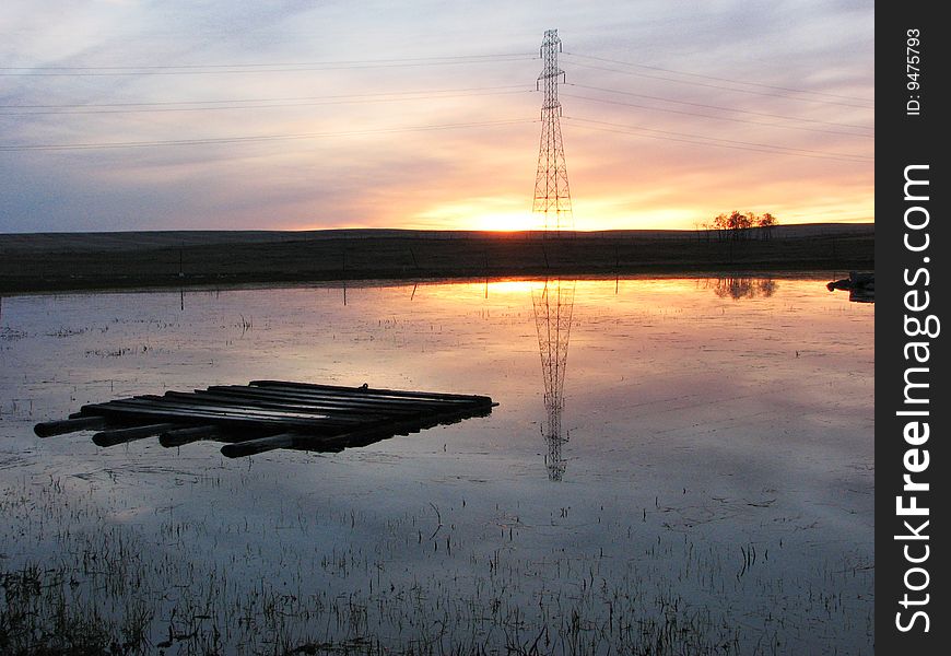 Raft Floating On Lake At Sunset