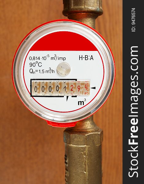 Meter and tubes   on the brown background