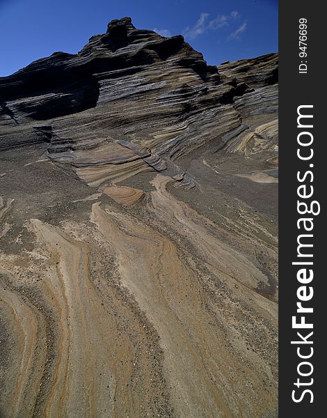 This is a picture of a canyon of volcanic rock against a blue sky in hawaii.