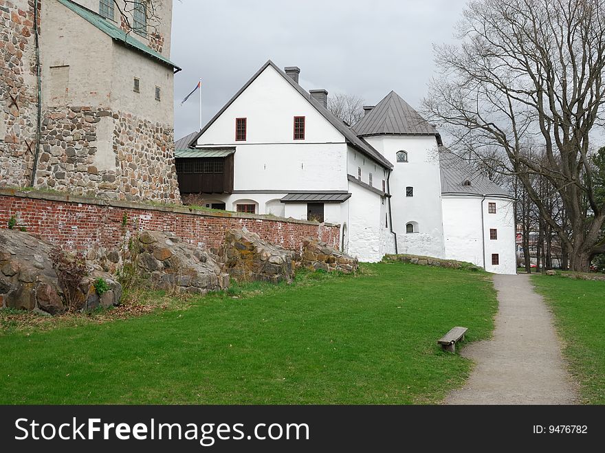 Medieval stone castle and park in Turku (Finland).  . Medieval stone castle and park in Turku (Finland).