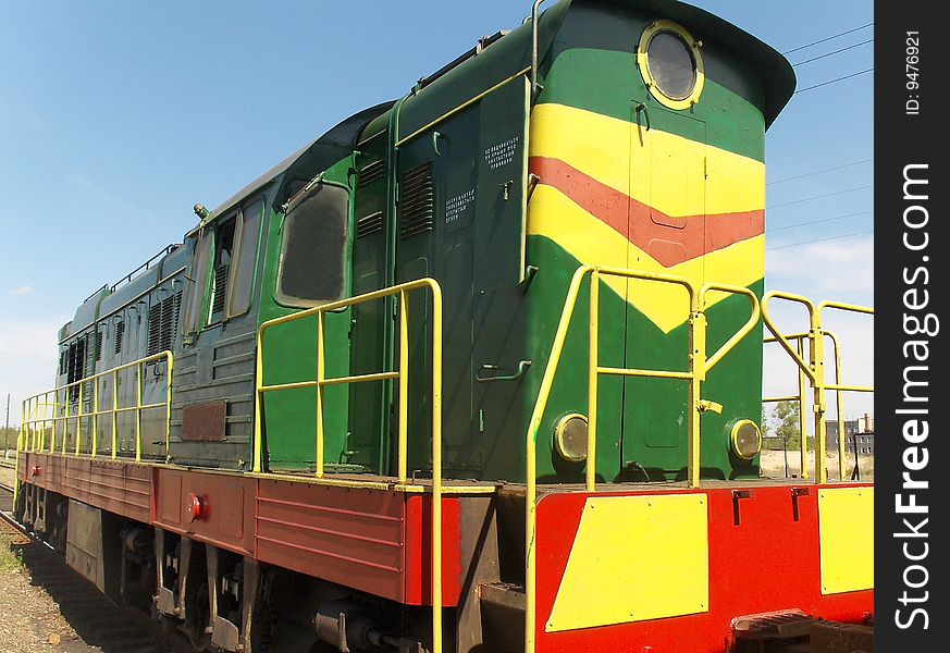 Small diesel locomotive on railway station.
Ukraine.
May 2009.