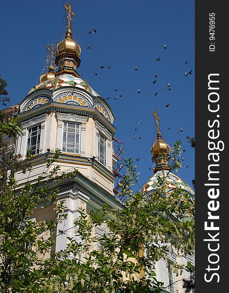 Peaceful Doves flying over Orthodox Cathedral, Almaty. Peaceful Doves flying over Orthodox Cathedral, Almaty