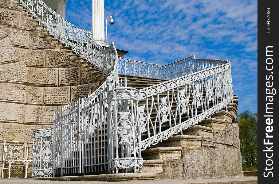 Beautiful classic stairs with metal handrail