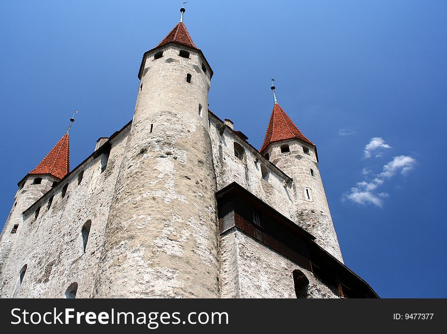 Thun Castle, Thun, Switzerland looking up from a low angle with blue sky.