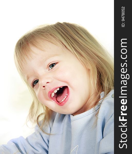 Smiling toddler girl over white portrait