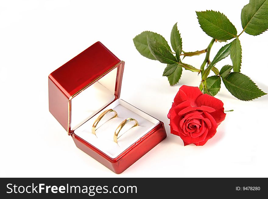Wedding rings in red box and rose. Wedding rings in red box and rose.