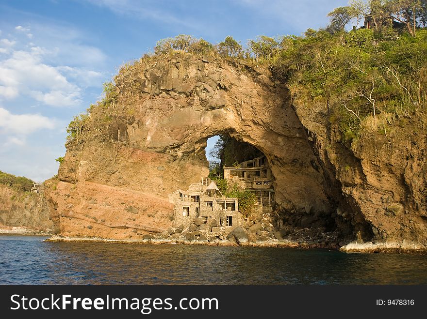 Abandon Art Colony at Adams Bay on thge island of Bequia, Grenadines. Unique tourist destination builted in the 60's, The arch is also refered to as the Moonhole. Abandon Art Colony at Adams Bay on thge island of Bequia, Grenadines. Unique tourist destination builted in the 60's, The arch is also refered to as the Moonhole