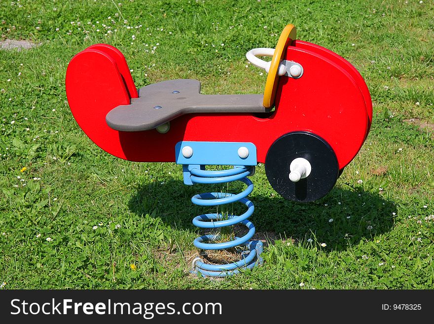 A rocking horse on steel spring for children as it can be found on playgrounds, primary schools and kindergarten