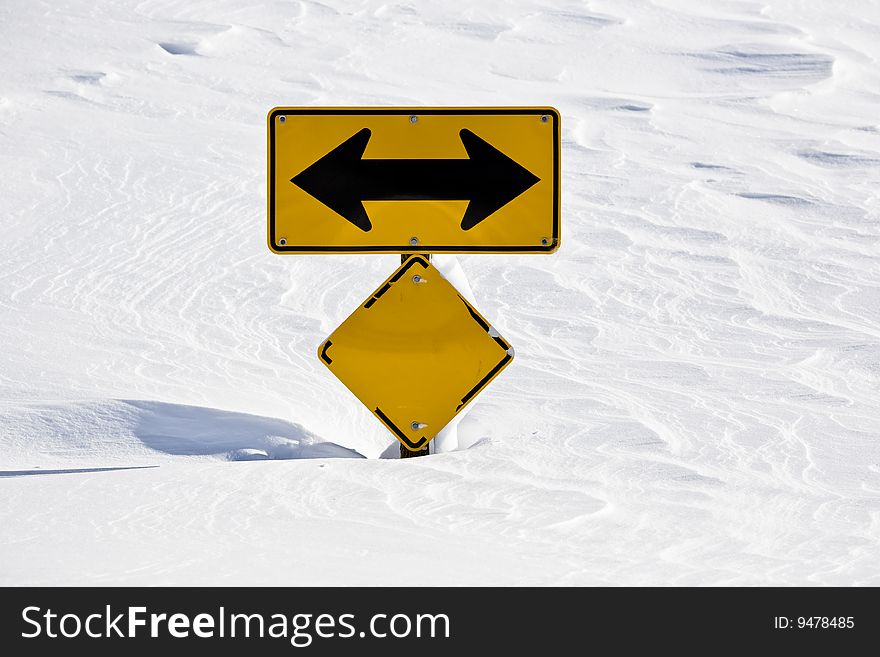 Sign buried in snow during a record breaking snowstorm. Sign buried in snow during a record breaking snowstorm