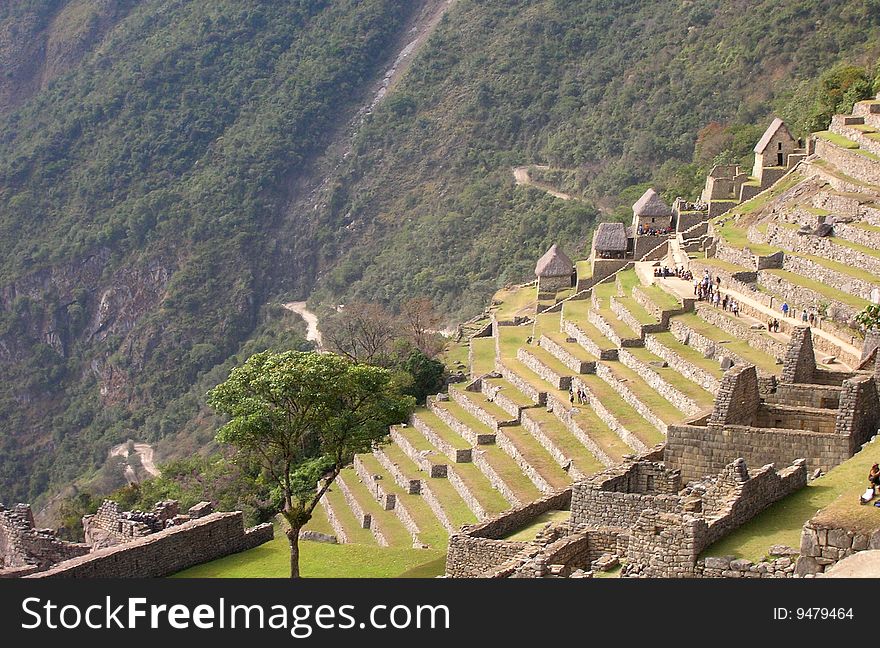 Machu Picchu showing terraces and the hairpin turn road that leads to it. Machu Picchu showing terraces and the hairpin turn road that leads to it