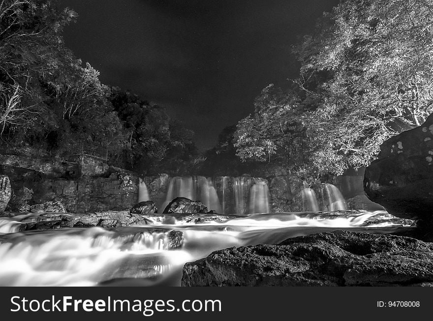Greyscale Photo of Waterfall during Nighttime