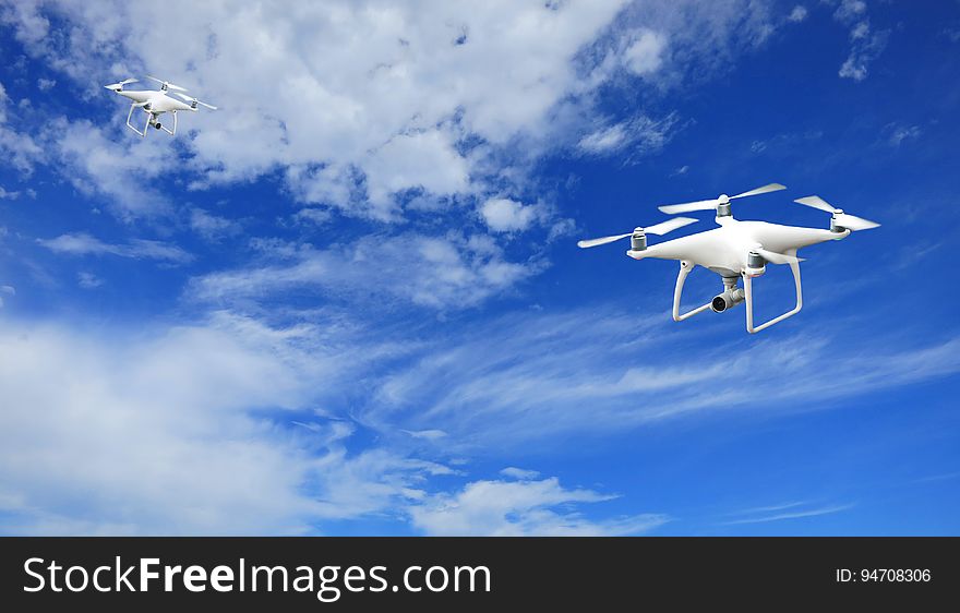 2 Quadcopter Under Blue Sky and White Clouds