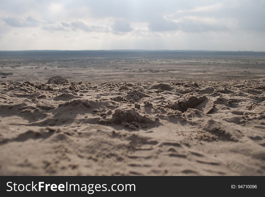 A desert landscape with sand dunes.