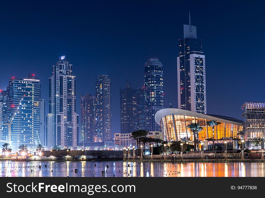 Illuminated waterfront of Dubai, United Arab Emirates at night. Illuminated waterfront of Dubai, United Arab Emirates at night.