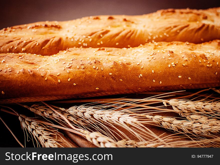 Loaves of fresh baked bread with grains of wheat. Loaves of fresh baked bread with grains of wheat.