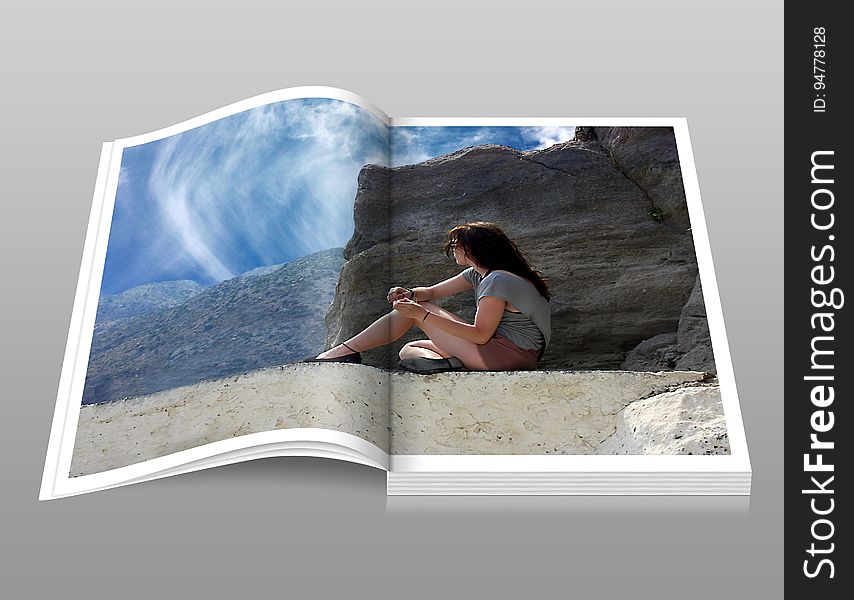 Woman in Gray Shirt Sitting over Brown Formation of Rock during Daytime Book