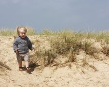Little Boy On Sand Dunes Stock Photography