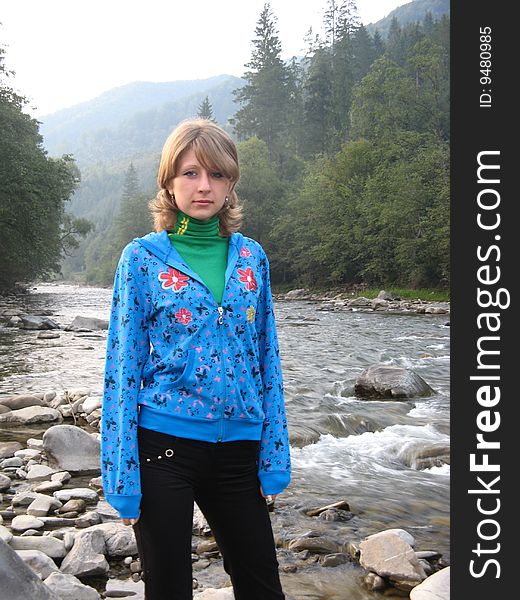 Girl ashore the small river in siney of kofotchke