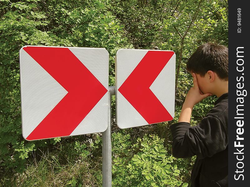 Boy on roads and sign in different way. Boy on roads and sign in different way