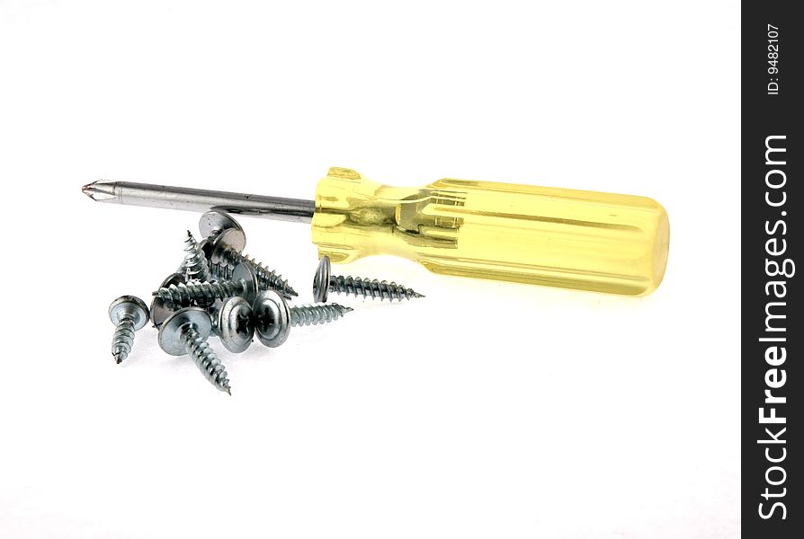 Screw-driver and screws on a white background