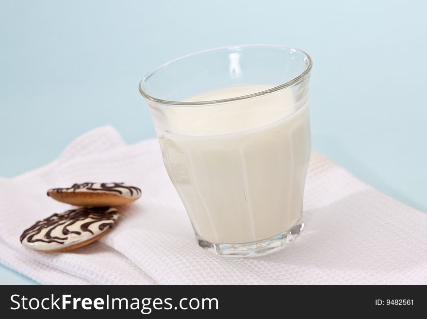 Food series: glass with milk and pastry on cloth