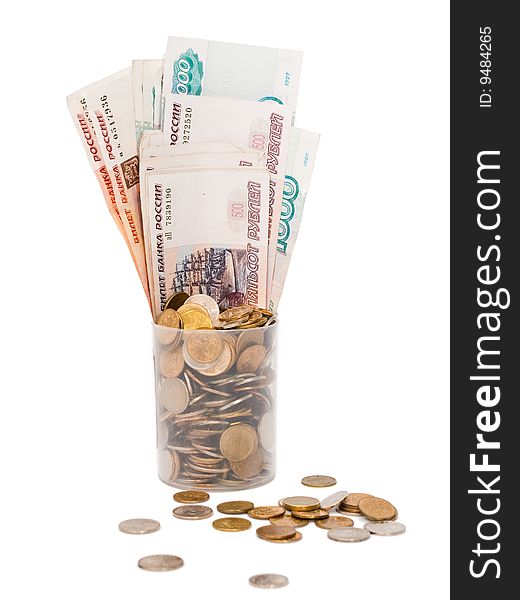 Plastic cup with russian coins and banknotes of different dignity on a white background, isolated. Plastic cup with russian coins and banknotes of different dignity on a white background, isolated