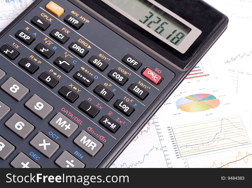 Financial statement with calculator and pen. Financial statement with calculator and pen