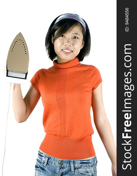 Charming, Asian girl holding iron. Young housewife ironing her clothes. Charming, Asian girl holding iron. Young housewife ironing her clothes.