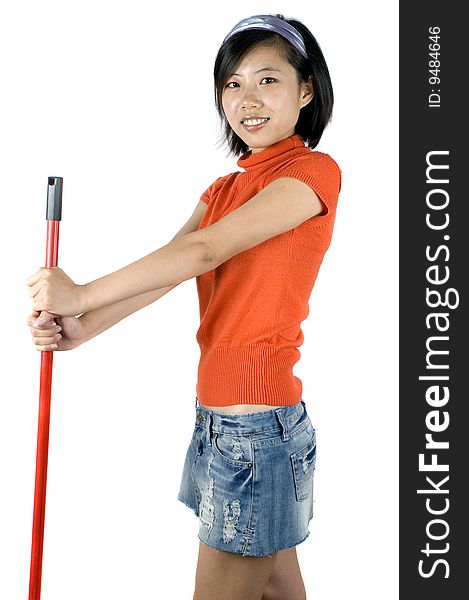 Happy, young Asian girl holding mop and cleaning house. Young housewife busy with her task. Happy, young Asian girl holding mop and cleaning house. Young housewife busy with her task.