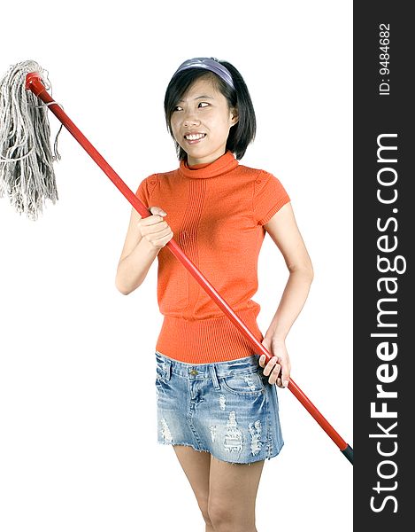 Happy, young Asian girl holding mop and cleaning house. Young housewife busy with her task. Happy, young Asian girl holding mop and cleaning house. Young housewife busy with her task.