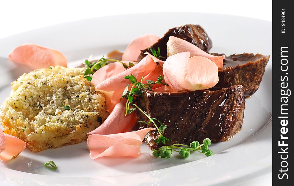 Beef Plate with Potatoes Galette Served with Boiled Rose Petal and Wine Sauce